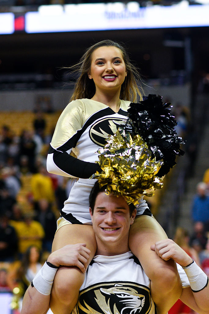 Missouri cheerleader Alexander Jackson holds
